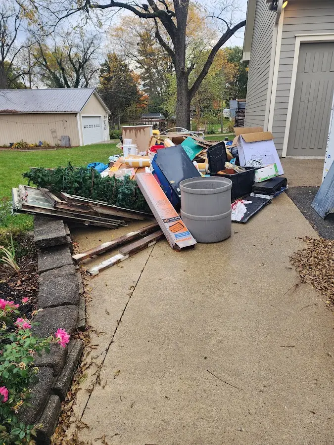 Dumpster being loaded with debris for Estate Cleanout Dumpster Rental in Salisbury